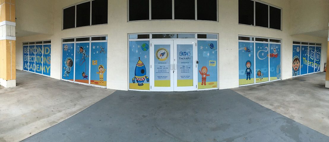 Beyond Expectations Academy campus in Miami with space-themed windows